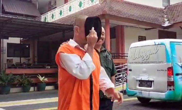 Terdakwa kasus pembunuhan dan mutilasi di Jalan Serayu Kota Malang (Andik Agus Mardiko/Blok-a.com)