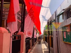 Semarak HUT RI, Warga Bareng Kartini Bentangkan Bendera Merah Putih 81 Meter malang