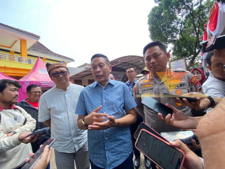 caption:%20Wali%20Kota%20Malang,%20Wahyu%20Hidayat%20bersama%20Kapolresta%20Malang%20Kota,%20Kombes%20Pol%20Danang%20diwawancara%20pada%20Minggu%20(27/9/2026)%20(blok-a.com/Bob%20Bimantara%20Leander)